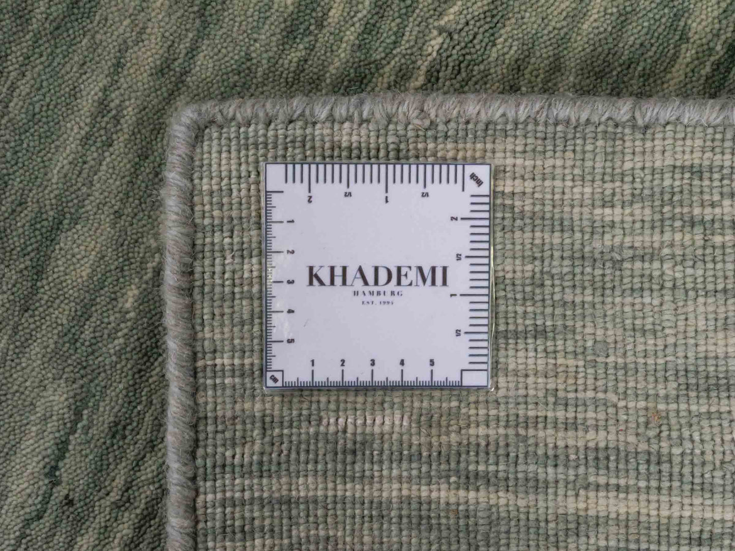 Moderner, Handloom Gabbeh Orientteppich von Khademi aus Wolle, mintgrün. Einfarbiges Uni-Design. Produziert in Indien. Größe: 93x60cm. Teppichnummer: KB4-1567. Verkauf durch Jupiter Intl.