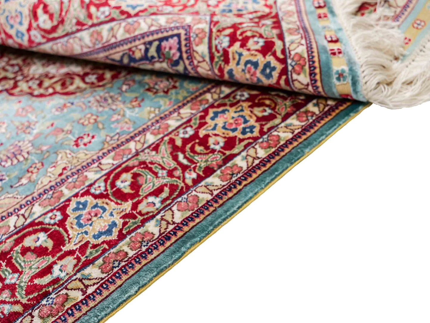 Sehr feiner, handgeknüpfter Khademi Orientteppich mit Ghom Design aus reiner Seide, blau, rot. 94x64 cm. Vertrieb durch Jupiter Intl.