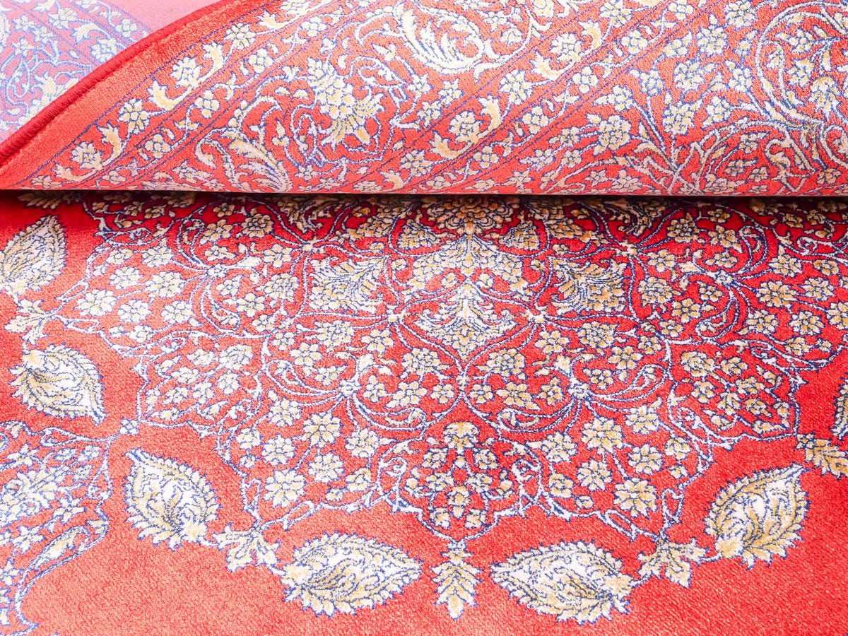 Ghom Maschinenteppich "Anahita" 120 x 80 cm aus pflanzlicher Seide (Viskose) mit Medaillon, Orange-Gold. Teppichnummer: V3BU096M. Persian Luxury Collection by Khademi. Made in Iran / Persia – Vertrieb durch JUPITER Intl.