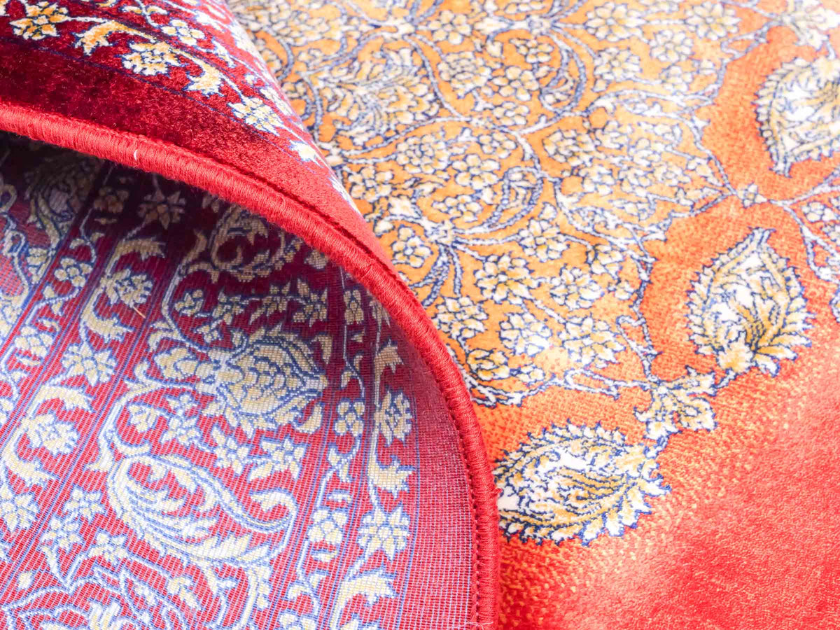 Ghom Maschinenteppich "Anahita" 120 x 80 cm aus pflanzlicher Seide (Viskose) mit Medaillon, Rot-Gold. Teppichnummer: V3RG096M. Persian Luxury Collection by Khademi. Made in Iran / Persia – Vertrieb durch JUPITER Intl.