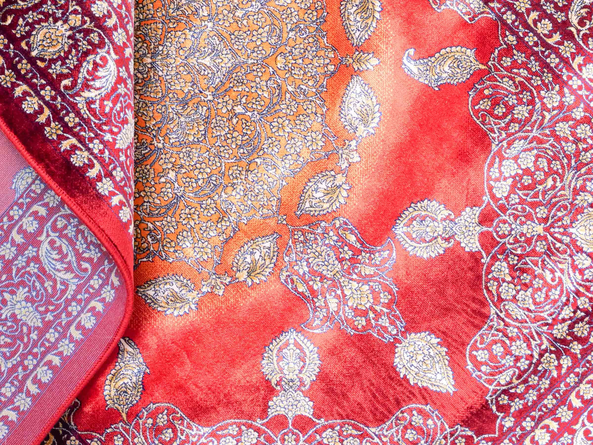 Ghom Maschinenteppich "Anahita" 120 x 80 cm aus pflanzlicher Seide (Viskose) mit Medaillon, Rot-Gold. Teppichnummer: V3RG096M. Persian Luxury Collection by Khademi. Made in Iran / Persia – Vertrieb durch JUPITER Intl.