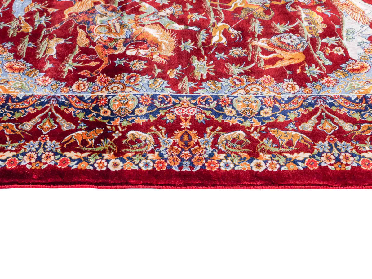 Ghom Maschinenteppich "Banu" 90 x 60 cm, mit Jagdmotiv, Rot, aus pflanzlicher Seide (Viskose), Hand-Finished. Teppichnummer: V13RD054H. Persian Luxury Collection by Khademi. Made in Iran / Persia – Vertrieb durch JUPITER Intl.