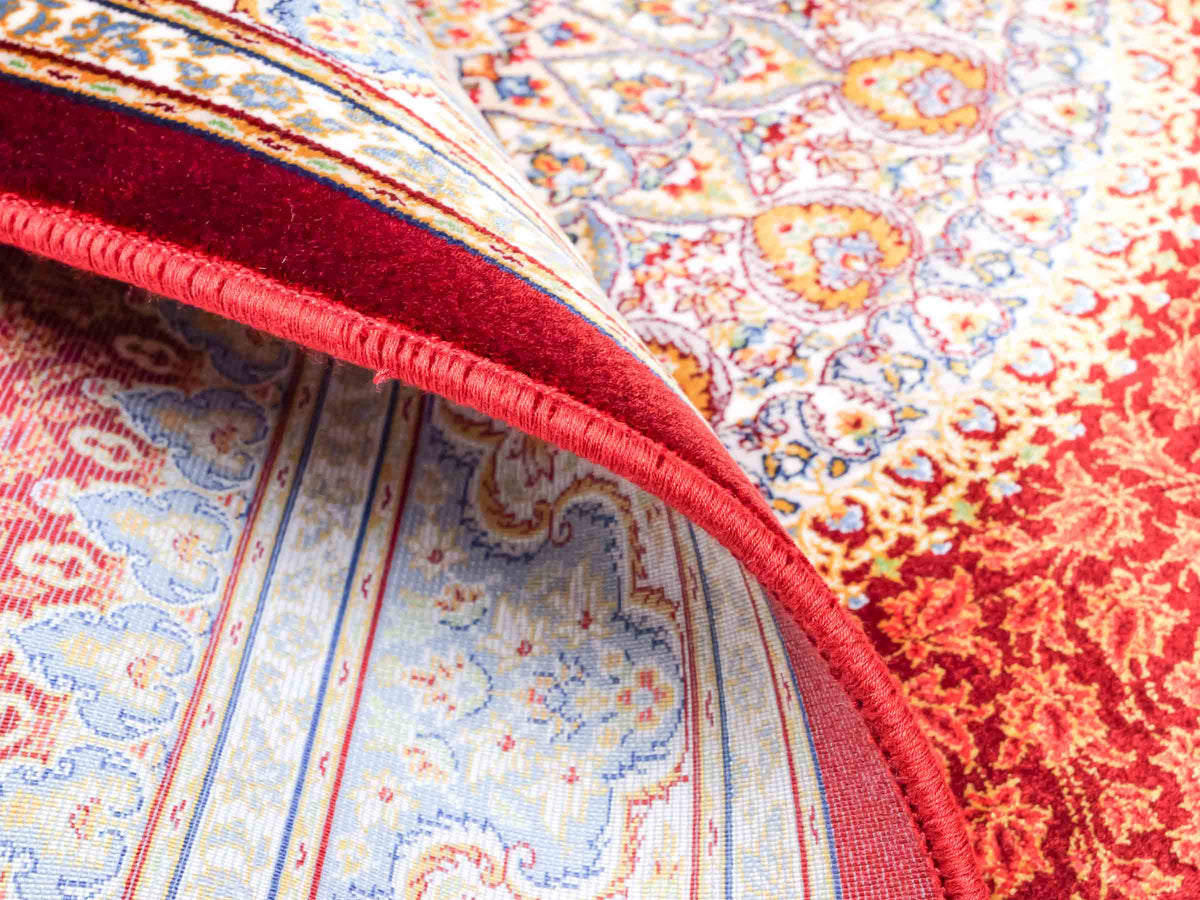 Ghom Maschinenteppich "Fereydun" 120 x 80 cm aus pflanzlicher Seide (Viskose) mit Medaillon, Rot-Orange. Teppichnummer: V28RD096M. Persian Luxury Collection by Khademi. Made in Iran / Persia – Vertrieb durch JUPITER Intl.
