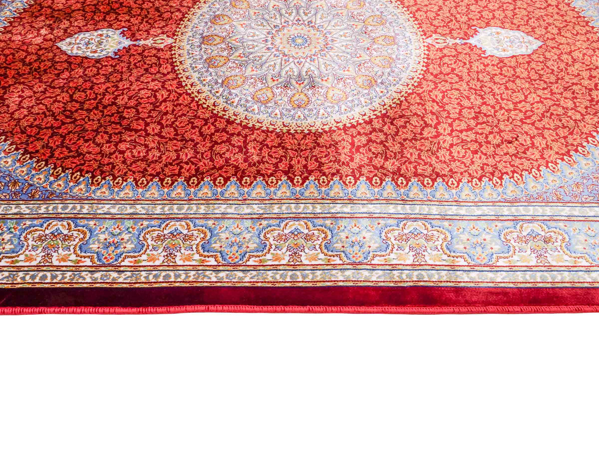 Ghom Maschinenteppich "Fereydun" 120 x 80 cm aus pflanzlicher Seide (Viskose) mit Medaillon, Rot-Orange. Teppichnummer: V28RD096M. Persian Luxury Collection by Khademi. Made in Iran / Persia – Vertrieb durch JUPITER Intl.