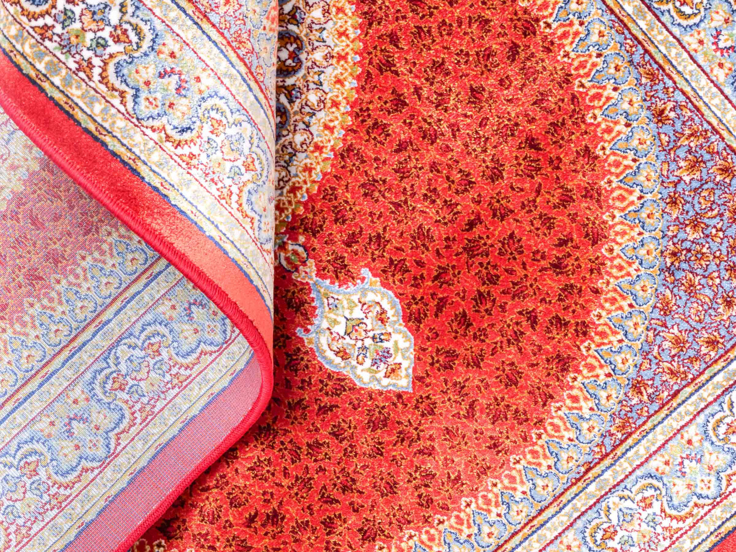 Ghom Maschinenteppich "Fereydun" 90 x 60 cm aus pflanzlicher Seide (Viskose) mit Medaillon, Orange. Teppichnummer: V28BU054M. Persian Luxury Collection by Khademi. Made in Iran / Persia – Vertrieb durch JUPITER Intl.
