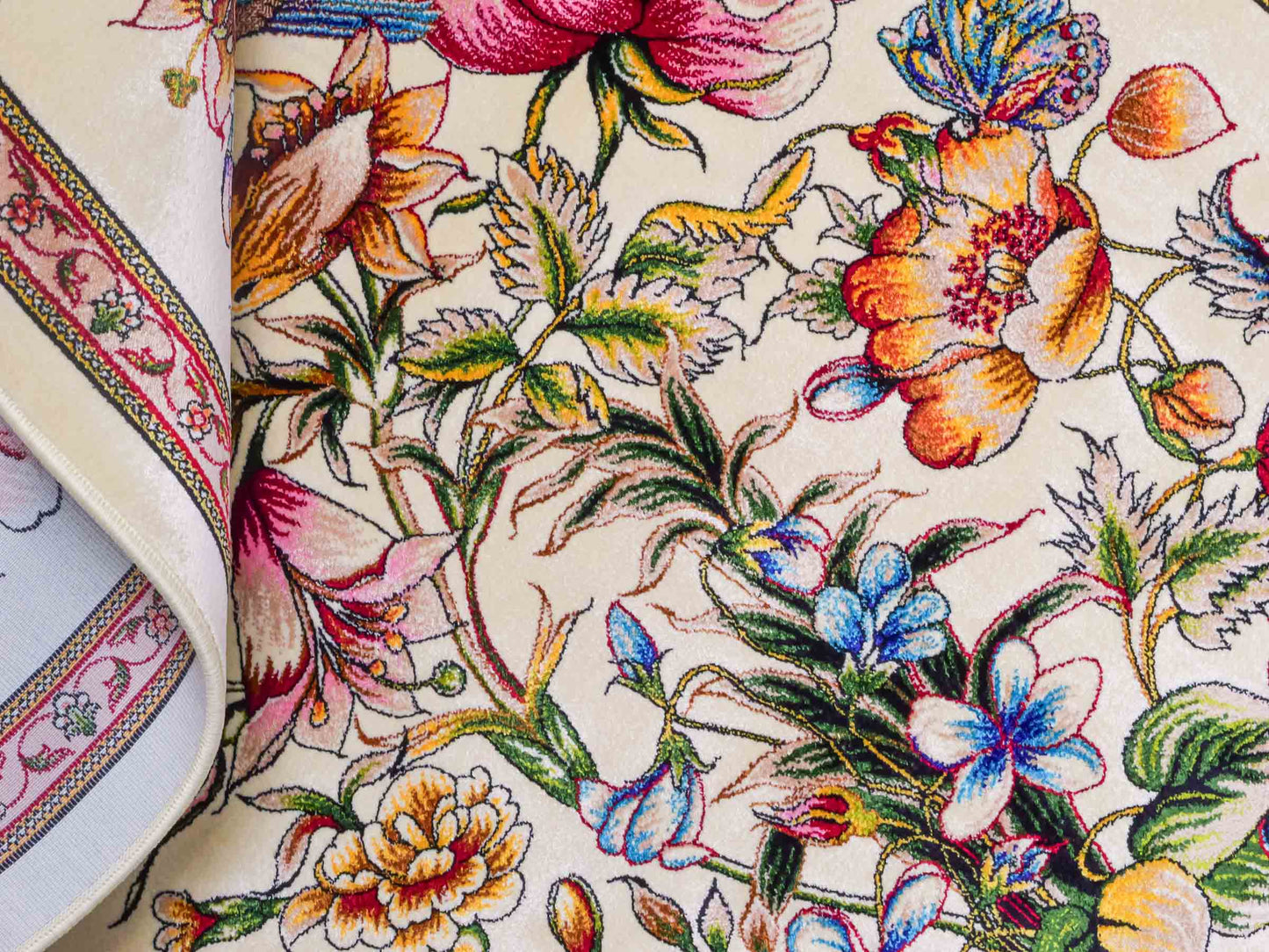 Ghom Maschinenteppich "Jamshid" 90 x 60 cm aus pflanzlicher Seide (Viskose) mit floralem Bildmotiv, Cremeweiß. Teppichnummer: V48CR054M Persian Luxury Collection by Khademi. Made in Iran / Persia – Vertrieb durch JUPITER Intl.