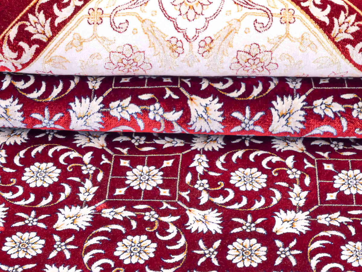 Ghom Maschinenteppich "Rakhsh" 180 x 120 cm, durchgemustert, aus pflanzlicher Seide (Viskose), Dunkelrot/Weiß. Teppichnummer: V71RD216H. Persian Luxury Collection by Khademi. Made in Iran / Persia – Vertrieb durch JUPITER Intl.