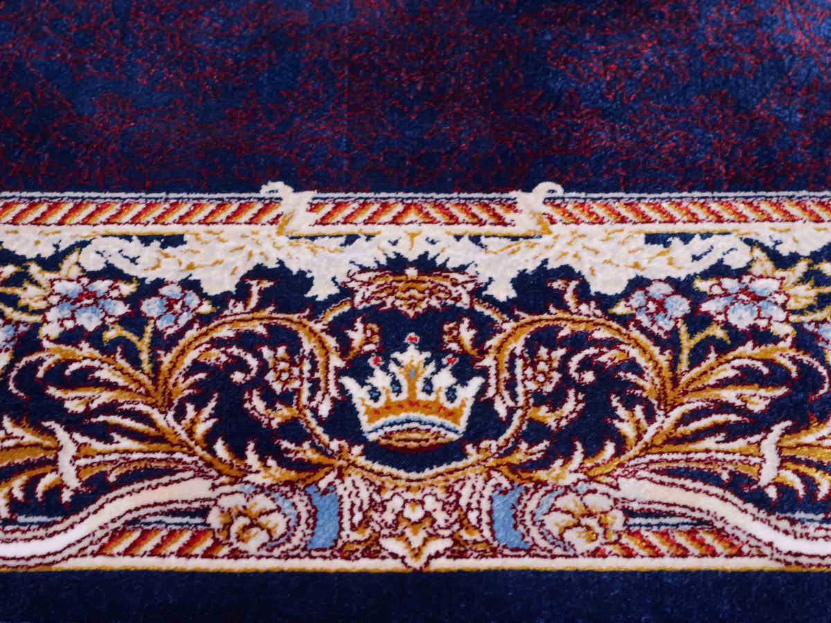 Ghom Maschinenteppich "Vishtasp" 120 x 80 cm aus pflanzlicher Seide (Viskose) mit Medaillon, Marineblau. Teppichnummer: V91NY096M. Persian Luxury Collection by Khademi. Made in Iran / Persia – Vertrieb durch JUPITER Intl.