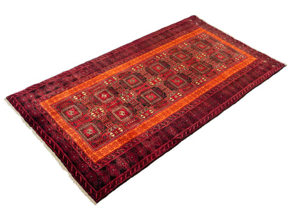 Handgeknüpfter, afghanischer, semi-antiker Belutsch Nomadenteppich aus Wolle von Khademi. Größe: 185 x 100 cm. Farbe: Rot, orange. Verkauf durch JUPITER Intl.