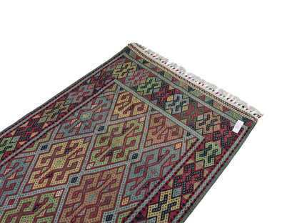Handgefertigter Kelim Afghan Teppich aus Wolle von Khademi. Größe 198 x 120 cm. Farbe: Grün, rot, blau. Verkauf durch JUPITER Intl.