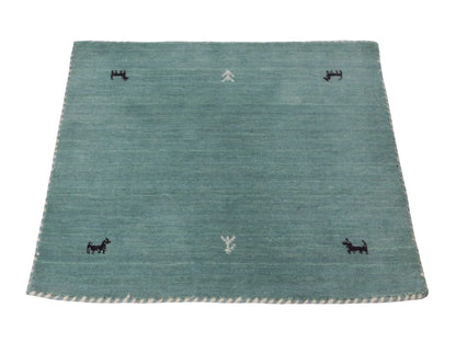 Moderner, Handloom Lori Gabbeh Orientteppich von Khademi aus Wolle, hellblau, türkis. Nomaden-Design. Produziert in Indien. Größe: 80x76cm. Teppichnummer: KB4-1601. Verkauf durch Jupiter Intl.