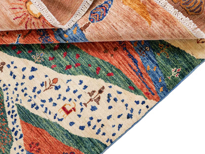 Moderner, handgeknüpfter, afghanischer Design Arijana Orientteppich aus Wolle von Khademi. Größe: 230 x 179 cm. Farbe: Beige, blau, grün. Vertrieb durch JUPITER Intl.