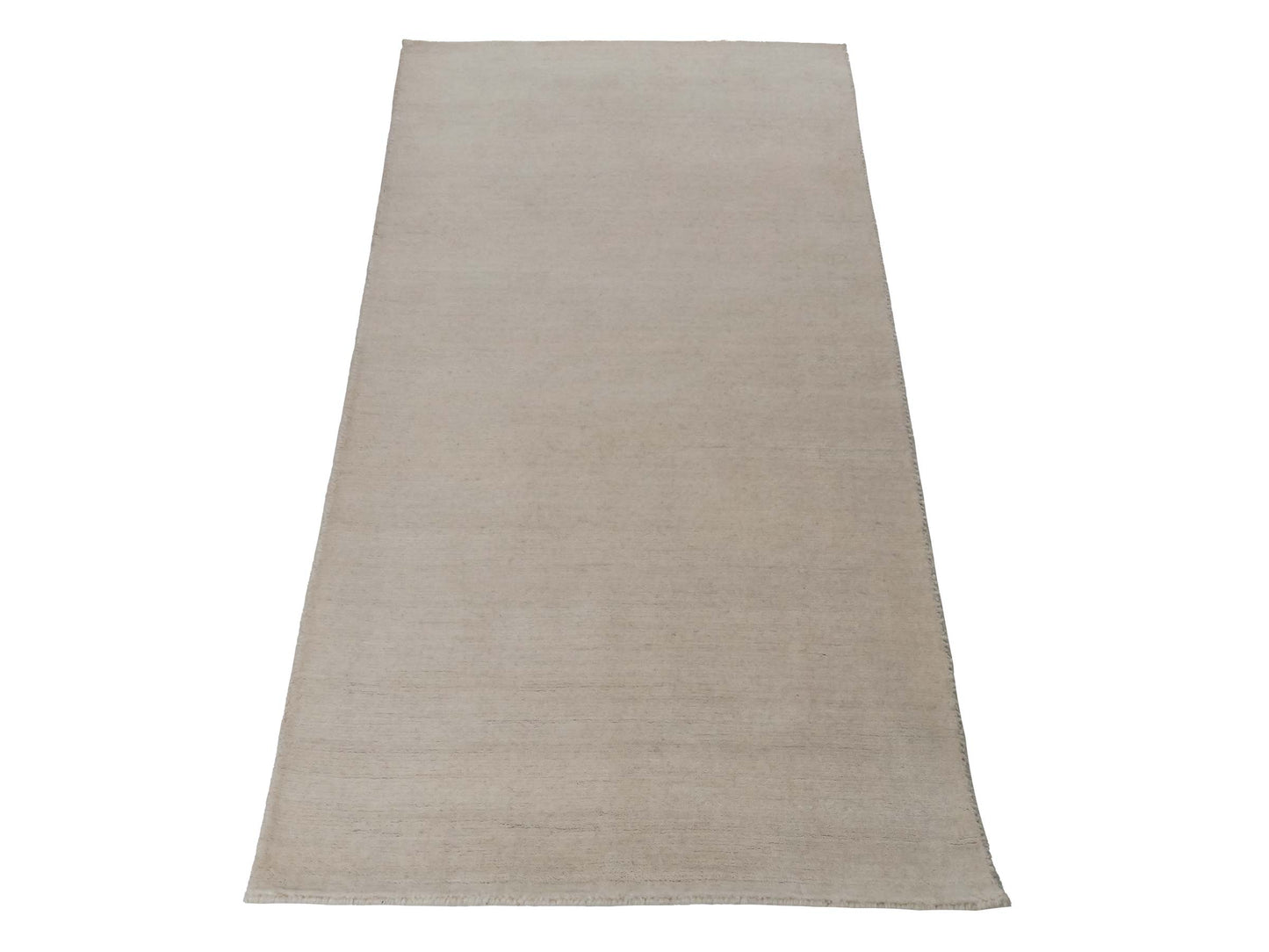 Moderner, Handloom Gabbeh Orientteppich von Khademi aus Wolle, cremeweiß. Einfarbiges Uni-Design. Produziert in Indien. Größe: 155x82cm. Teppichnummer: KB4-1563. Verkauf durch Jupiter Intl.