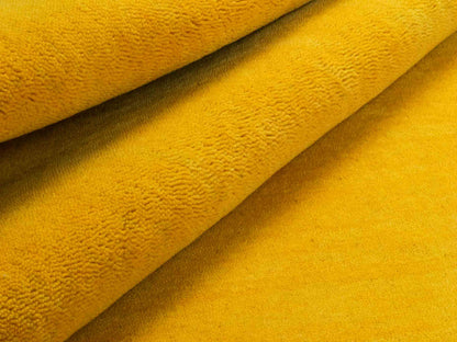 Moderner, Handloom Gabbeh Orientteppich von Khademi aus Wolle, gelb. Einfarbiges Uni-Design. Produziert in Indien. Größe: 170x117cm. Teppichnummer: KB4-1572. Verkauf durch Jupiter Intl.