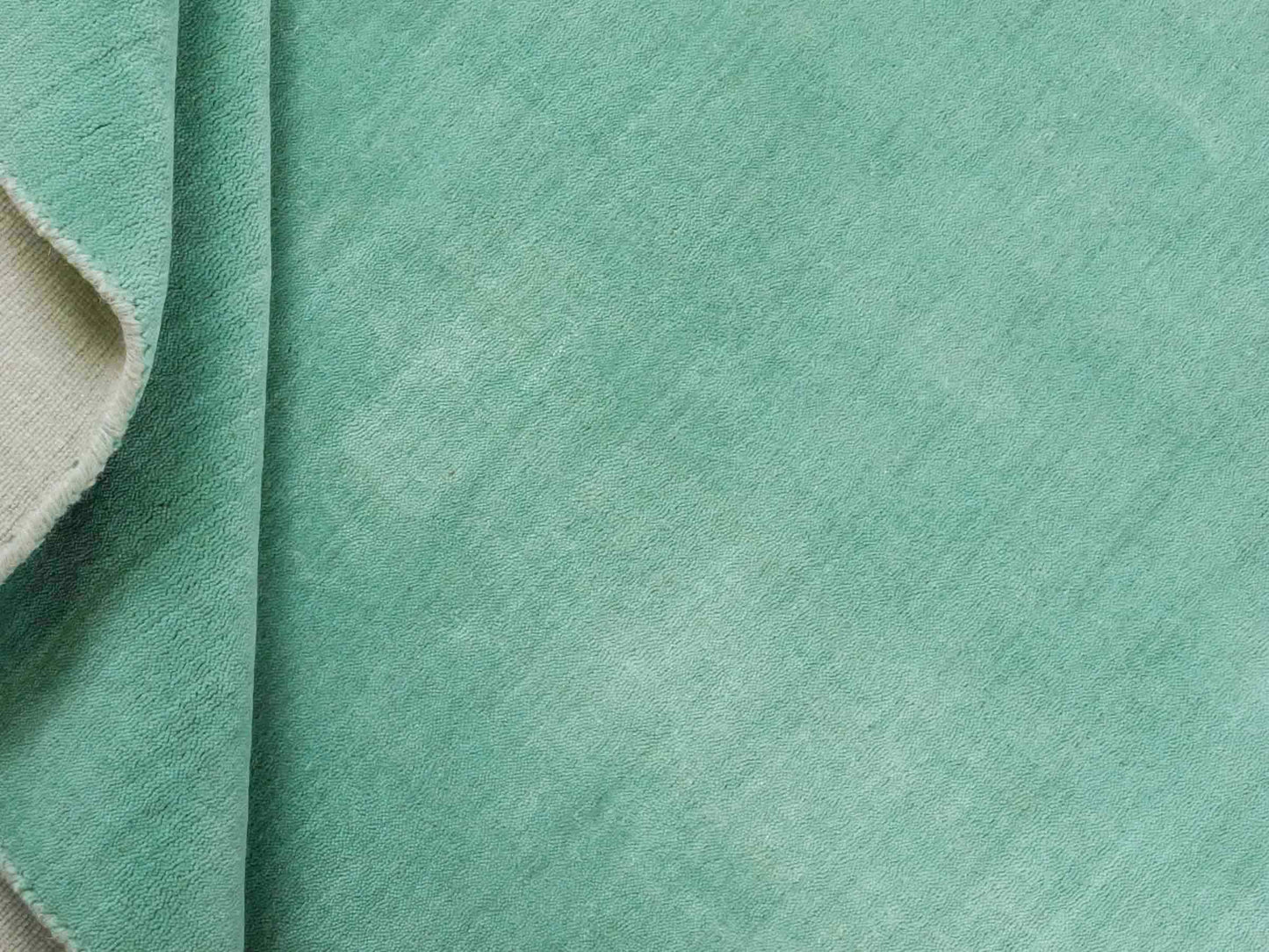 Moderner, Handloom Gabbeh Orientteppich von Khademi aus Wolle, türkis. Einfarbiges Uni-Design. Produziert in Indien. Größe: 170x120cm. Teppichnummer: KB4-1587. Verkauf durch Jupiter Intl.