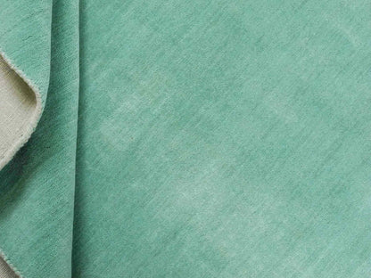 Moderner, Handloom Gabbeh Orientteppich von Khademi aus Wolle, türkis. Einfarbiges Uni-Design. Produziert in Indien. Größe: 170x120cm. Teppichnummer: KB4-1587. Verkauf durch Jupiter Intl.