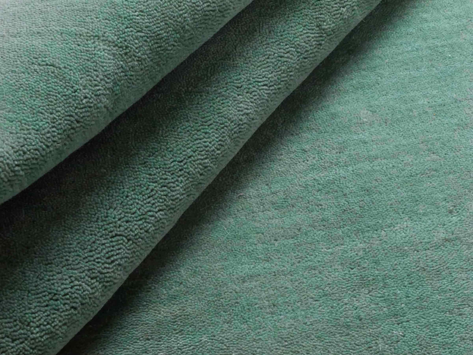 Moderner, Handloom Gabbeh Orientteppich von Khademi aus Wolle, türkis. Einfarbiges Uni-Design. Produziert in Indien. Größe: 170x120cm. Teppichnummer: KB4-1587. Verkauf durch Jupiter Intl.