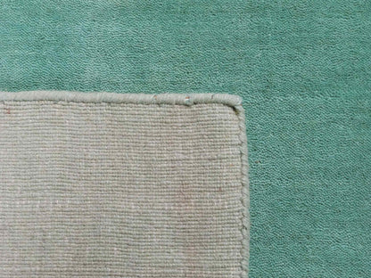 Moderner, Handloom Gabbeh Orientteppich von Khademi aus Wolle, türkis. Einfarbiges Uni-Design. Produziert in Indien. Größe: 170x120cm. Teppichnummer: KB4-1587. Verkauf durch Jupiter Intl.