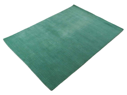 Moderner, Handloom Gabbeh Orientteppich von Khademi aus Wolle, türkis. Einfarbiges Uni-Design. Produziert in Indien. Größe: 170x120cm. Teppichnummer: KB4-1587. Verkauf durch Jupiter Intl.