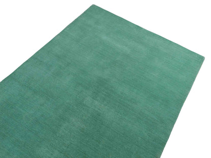 Moderner, Handloom Gabbeh Orientteppich von Khademi aus Wolle, türkis. Einfarbiges Uni-Design. Produziert in Indien. Größe: 170x120cm. Teppichnummer: KB4-1587. Verkauf durch Jupiter Intl.