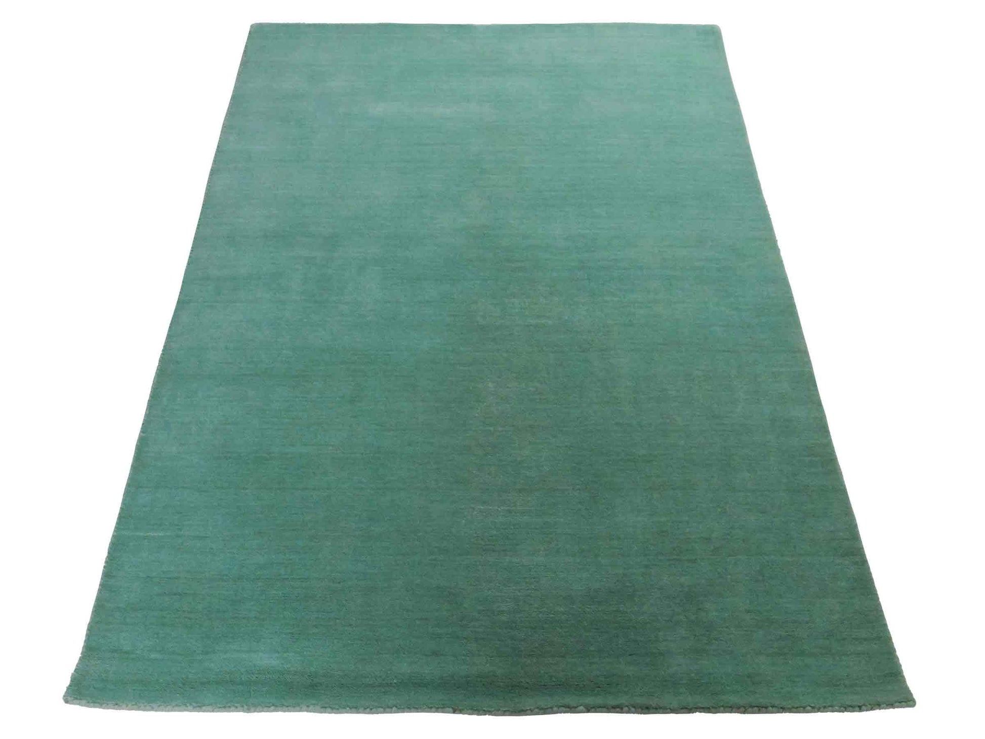 Moderner, Handloom Gabbeh Orientteppich von Khademi aus Wolle, türkis. Einfarbiges Uni-Design. Produziert in Indien. Größe: 170x120cm. Teppichnummer: KB4-1587. Verkauf durch Jupiter Intl.