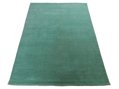 Moderner, Handloom Gabbeh Orientteppich von Khademi aus Wolle, türkis. Einfarbiges Uni-Design. Produziert in Indien. Größe: 170x120cm. Teppichnummer: KB4-1587. Verkauf durch Jupiter Intl.