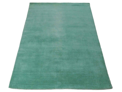 Moderner, Handloom Gabbeh Orientteppich von Khademi aus Wolle, türkis. Einfarbiges Uni-Design. Produziert in Indien. Größe: 170x120cm. Teppichnummer: KB4-1587. Verkauf durch Jupiter Intl.