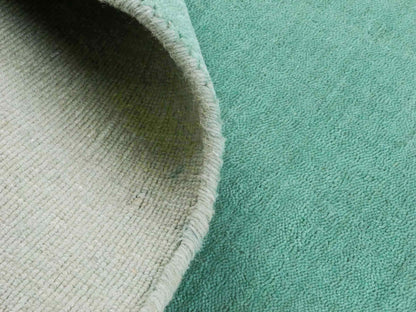 Moderner, Handloom Gabbeh Orientteppich von Khademi aus Wolle, türkis. Einfarbiges Uni-Design. Produziert in Indien. Größe: 170x120cm. Teppichnummer: KB4-1587. Verkauf durch Jupiter Intl.