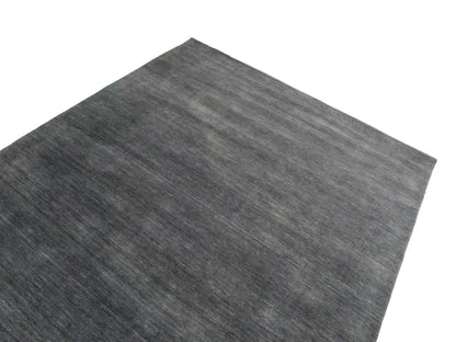 Moderner, Handloom Gabbeh Orientteppich von Khademi aus Wolle, anthrazit. Einfarbiges Uni-Design. Produziert in Indien. Größe: 292x200cm. Teppichnummer: KB4-1613. Verkauf durch Jupiter Intl.