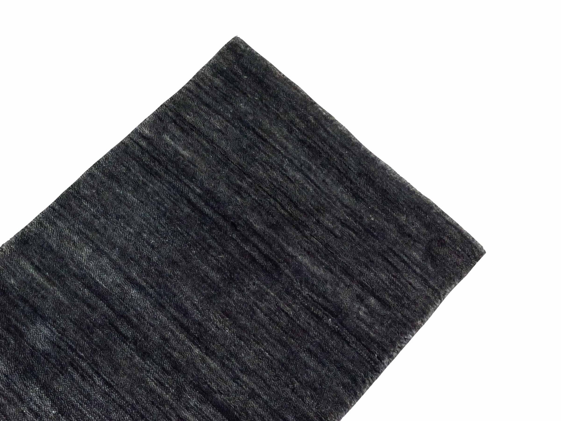 Moderner, Handloom Gabbeh Orientteppich von Khademi aus Wolle, anthrazit-grau. Einfarbiges Uni-Design. Produziert in Indien. Größe: 60x40cm. Teppichnummer: KB4-1617. Verkauf durch Jupiter Intl.