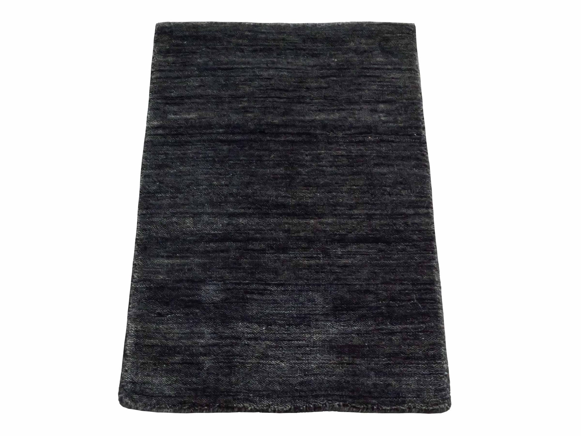 Moderner, Handloom Gabbeh Orientteppich von Khademi aus Wolle, anthrazit-grau. Einfarbiges Uni-Design. Produziert in Indien. Größe: 60x40cm. Teppichnummer: KB4-1617. Verkauf durch Jupiter Intl.