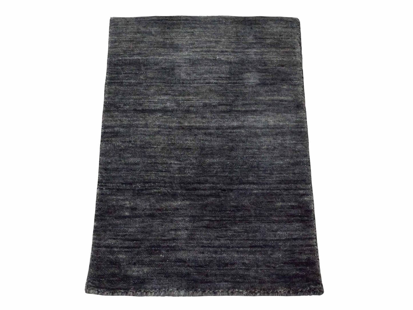 Moderner, Handloom Gabbeh Orientteppich von Khademi aus Wolle, anthrazit-grau. Einfarbiges Uni-Design. Produziert in Indien. Größe: 60x40cm. Teppichnummer: KB4-1617. Verkauf durch Jupiter Intl.