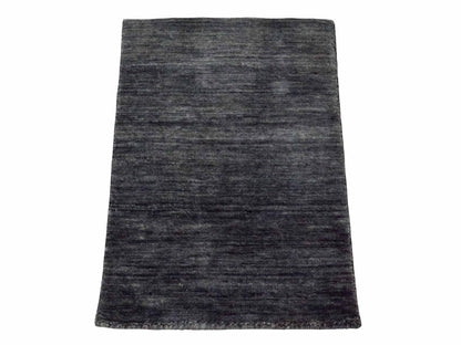 Moderner, Handloom Gabbeh Orientteppich von Khademi aus Wolle, anthrazit-grau. Einfarbiges Uni-Design. Produziert in Indien. Größe: 60x40cm. Teppichnummer: KB4-1617. Verkauf durch Jupiter Intl.