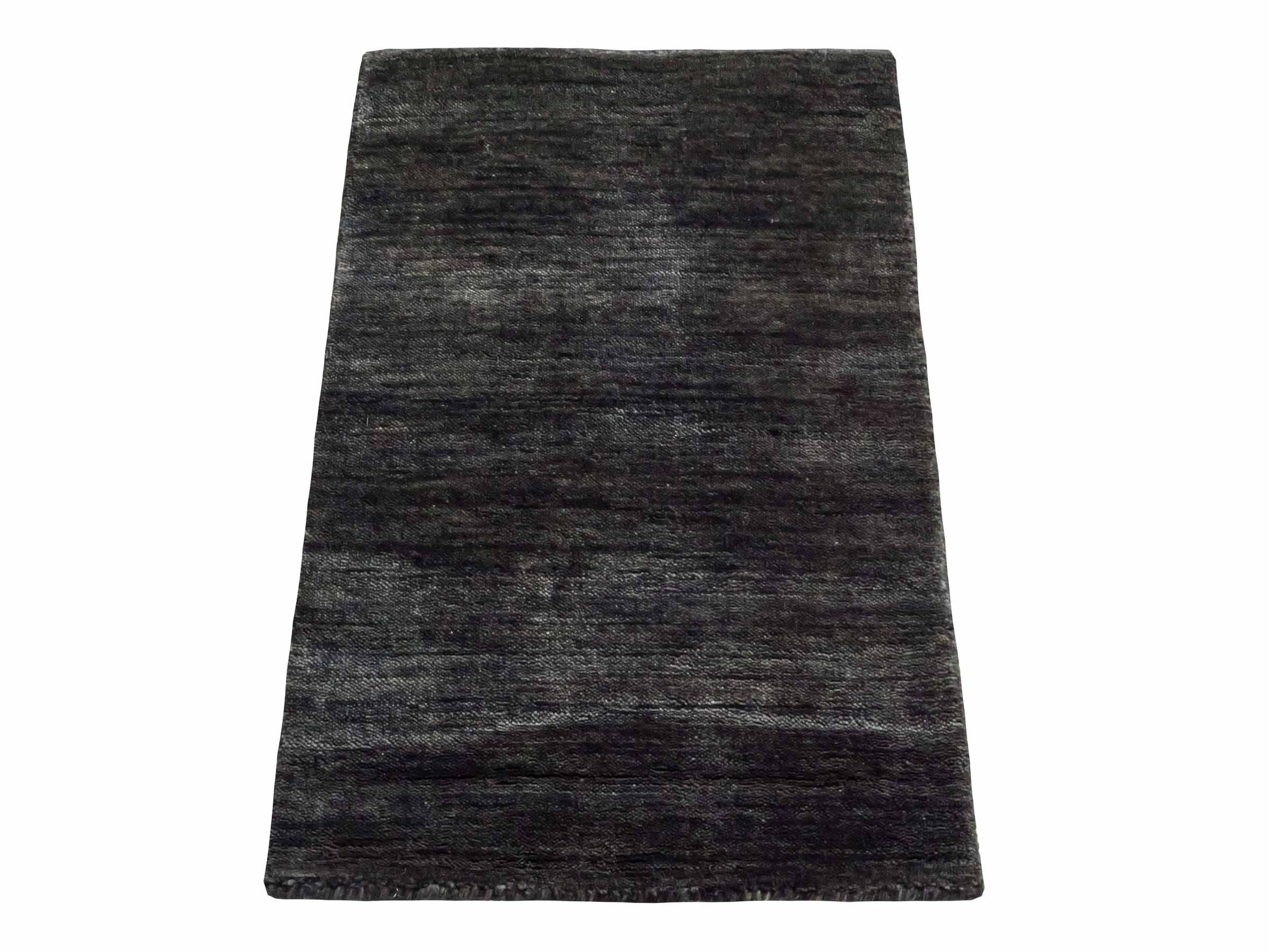 Moderner, Handloom Gabbeh Orientteppich von Khademi aus Wolle, anthrazit-grau. Einfarbiges Uni-Design. Produziert in Indien. Größe: 60x40cm. Teppichnummer: KB4-1617D. Verkauf durch Jupiter Intl.