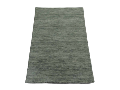 Moderner, Handloom Gabbeh Orientteppich von Khademi aus Wolle, mintgrün. Einfarbiges Uni-Design. Produziert in Indien. Größe: 93x60cm. Teppichnummer: KB4-1567. Verkauf durch Jupiter Intl.