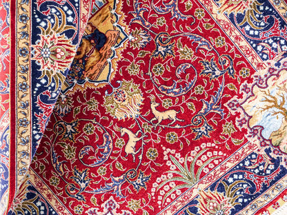 Sehr feiner, handgeknüpfter Khademi Orientteppich mit Ghom Design aus reiner Seide, rot, blau. 93x63 cm. Vertrieb durch Jupiter Intl.