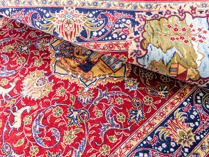 Sehr feiner, handgeknüpfter Khademi Orientteppich mit Ghom Design aus reiner Seide, rot, blau. 93x63 cm. Vertrieb durch Jupiter Intl.