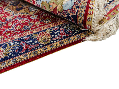 Sehr feiner, handgeknüpfter Khademi Orientteppich mit Ghom Design aus reiner Seide, rot, blau. 93x63 cm. Vertrieb durch Jupiter Intl.