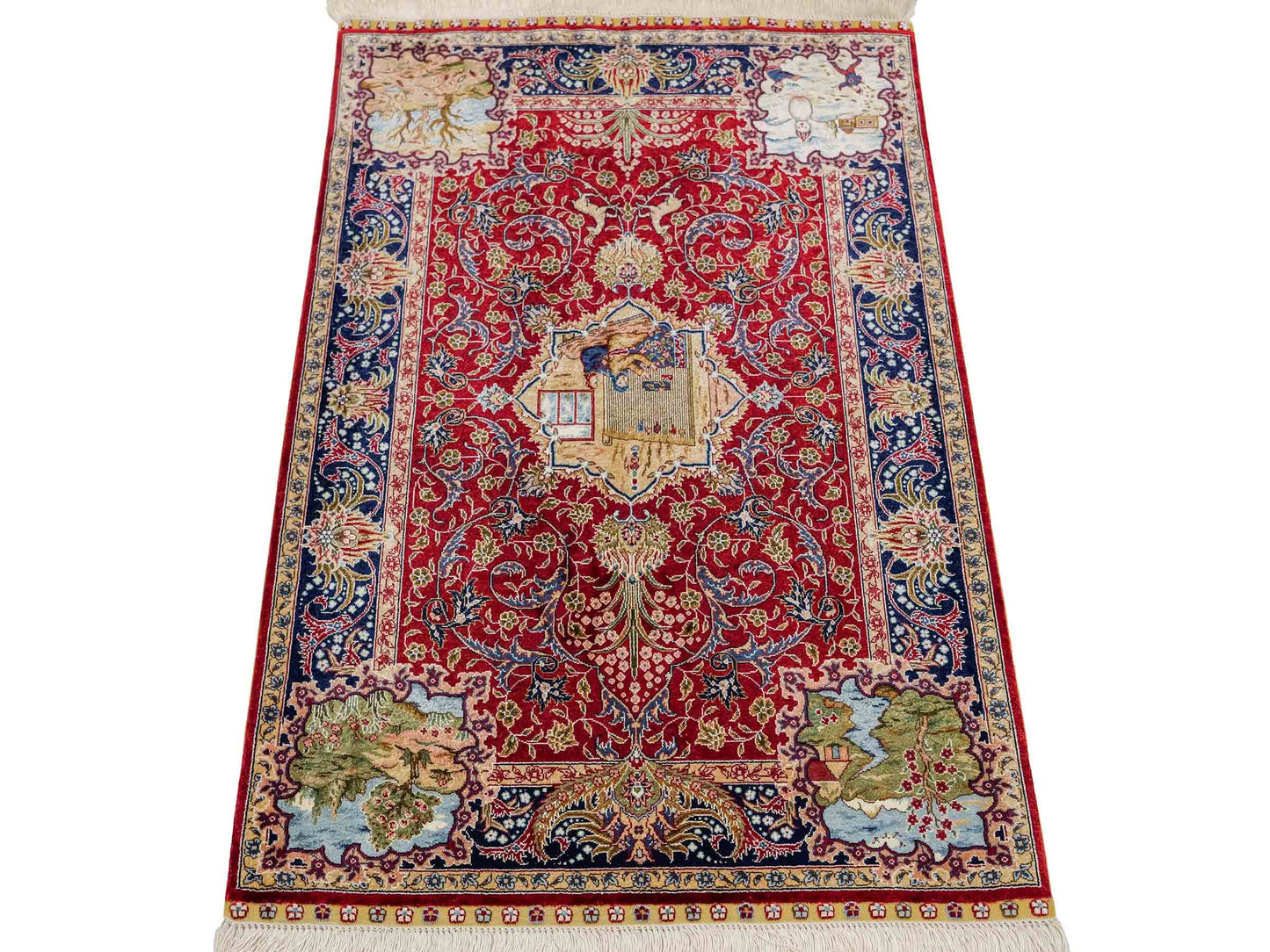 Sehr feiner, handgeknüpfter Khademi Orientteppich mit Ghom Design aus reiner Seide, rot, blau. 93x63 cm. Vertrieb durch Jupiter Intl.