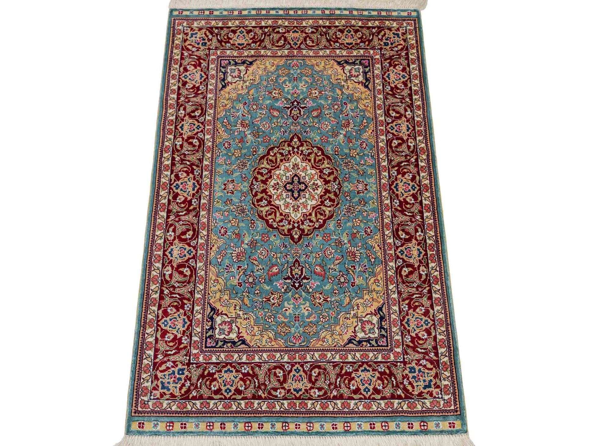 Sehr feiner, handgeknüpfter Khademi Orientteppich mit Ghom Design aus reiner Seide, blau, rot. 94x64 cm. Vertrieb durch Jupiter Intl.
