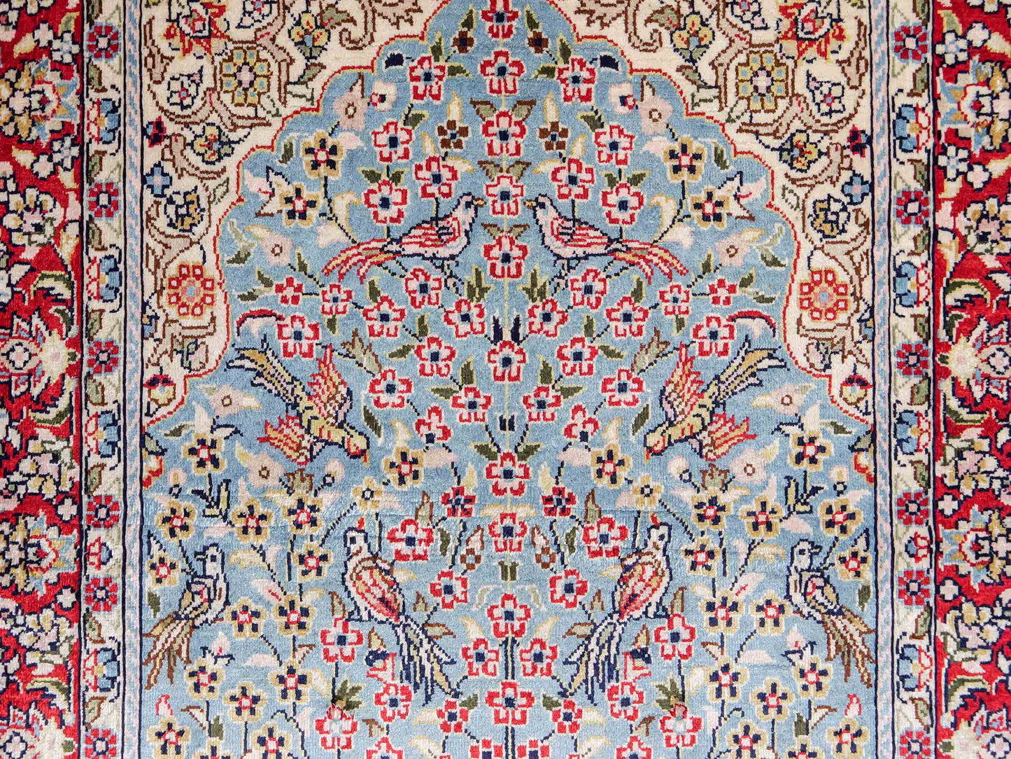 Sehr feiner, handgeknüpfter Khademi Orientteppich mit Hereke Design aus reiner Seide, blau, rot, creme. 65x47 cm. Vertrieb durch Jupiter Intl.