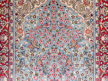 Sehr feiner, handgeknüpfter Khademi Orientteppich mit Hereke Design aus reiner Seide, blau, rot, creme. 65x47 cm. Vertrieb durch Jupiter Intl.