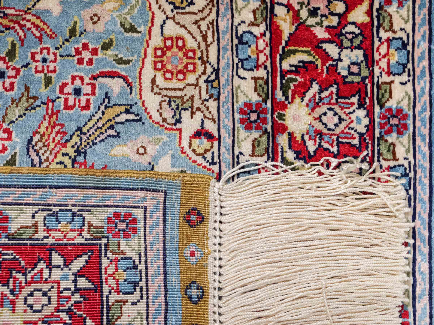 Sehr feiner, handgeknüpfter Khademi Orientteppich mit Hereke Design aus reiner Seide, blau, rot, creme. 65x47 cm. Vertrieb durch Jupiter Intl.