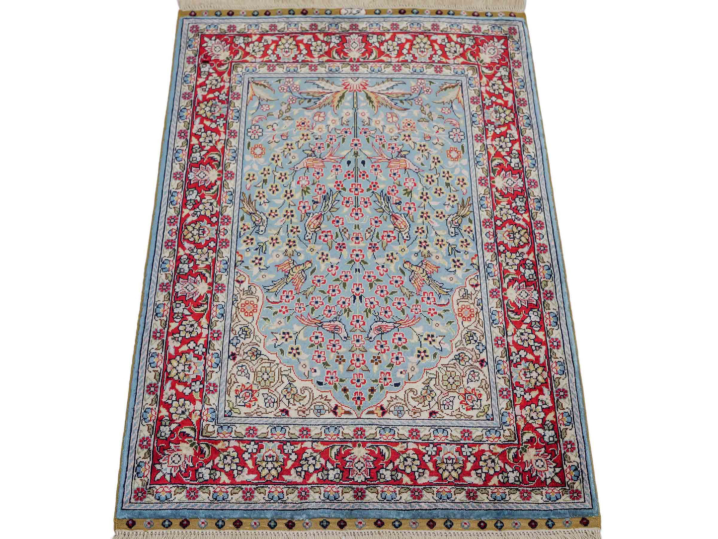 Sehr feiner, handgeknüpfter Khademi Orientteppich mit Hereke Design aus reiner Seide, blau, rot, creme. 65x47 cm. Vertrieb durch Jupiter Intl.