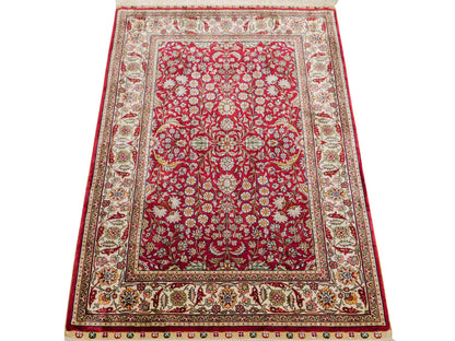 Sehr feiner, handgeknüpfter Khademi Orientteppich mit Hereke Design aus reiner Seide, rot, creme. 92x62 cm. Vertrieb durch Jupiter Intl.